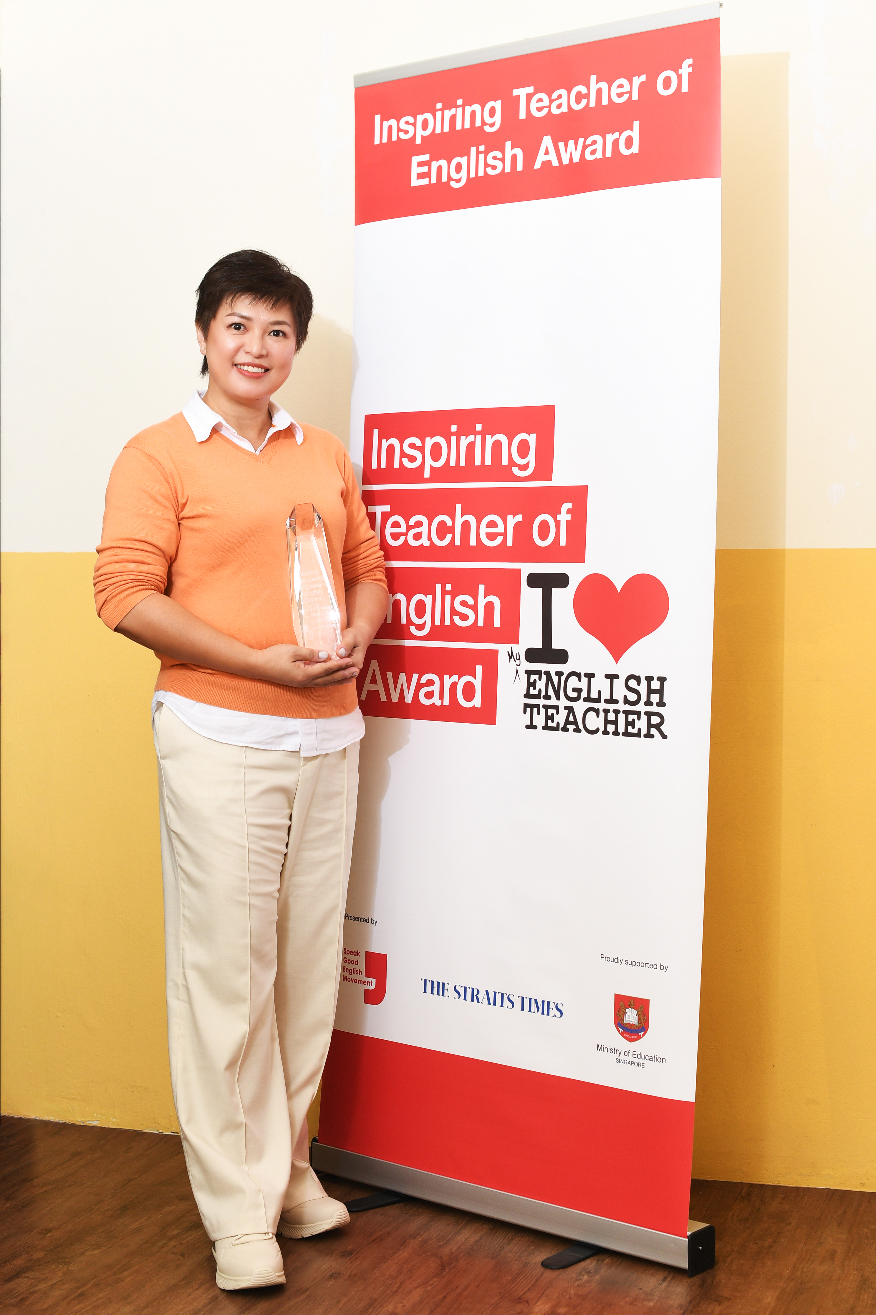 Teo Mei Chin Betsy standing with trophy